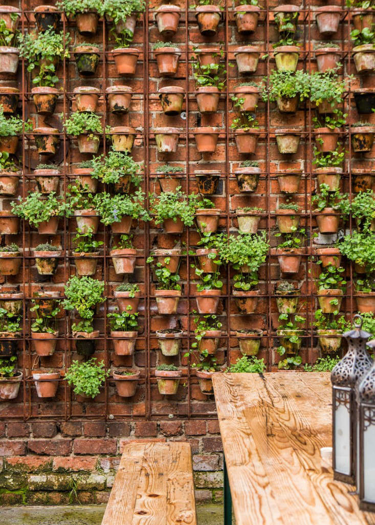 Design Sleuth Vertical Garden of Terra Cotta Pots Gardenista